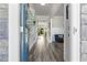 Bright foyer featuring wood floors and an open view into the home's living spaces at 6070 Arbor Green Cir, Sugar Hill, GA 30518