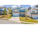 Beautiful two-story home with a stone facade, well-manicured lawn, and a two-car garage at 6070 Arbor Green Cir, Sugar Hill, GA 30518