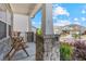 Inviting front porch with stone columns and a cozy seating area at 6070 Arbor Green Cir, Sugar Hill, GA 30518