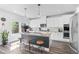 Modern kitchen featuring a center island with bar seating and stainless steel appliances at 6070 Arbor Green Cir, Sugar Hill, GA 30518