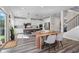 Open concept kitchen with stainless steel appliances, white cabinets, and large island, great for entertaining at 6070 Arbor Green Cir, Sugar Hill, GA 30518
