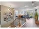 Open and airy living room showcasing modern decor and ample natural light from multiple windows at 6070 Arbor Green Cir, Sugar Hill, GA 30518