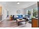 Well-lit living room with comfortable seating, modern decor, and scenic outdoor views at 6070 Arbor Green Cir, Sugar Hill, GA 30518