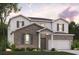 Charming two-story home with brick and vinyl siding, a front porch, and an attached garage at 7109 Brushwood Bend - Lot 47, Lithonia, GA 30058