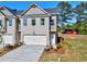Charming, newly built townhome with a two-car garage, neutral color palette, and fresh landscaping at 1207 Fern Ridge Ct # 15, Norcross, GA 30093