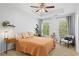 Cozy bedroom featuring tray ceiling, ample natural light, and calming decor at 1723 Highlands Se Vw, Smyrna, GA 30082