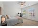 Bedroom with ceiling fan, carpet, and view to outdoors from two windows at 1723 Highlands Se Vw, Smyrna, GA 30082