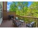 Relaxing deck featuring outdoor seating, grill, and a view of lush greenery at 1723 Highlands Se Vw, Smyrna, GA 30082