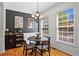 Dining room with stylish lighting, hardwood floors, and large windows at 1723 Highlands Se Vw, Smyrna, GA 30082