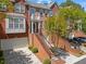 Charming brick townhome with a two-car garage and landscaped front steps, showcasing lovely curb appeal at 1723 Highlands Se Vw, Smyrna, GA 30082