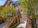 Beautiful red brick townhome with mature trees offering lots of shade for enjoying the outdoors at 1723 Highlands Se Vw, Smyrna, GA 30082