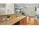 Modern kitchen with an island sink overlooks the open-concept living space with lots of natural light and hardwood floors at 1723 Highlands Se Vw, Smyrna, GA 30082