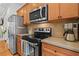 Well-equipped kitchen features stainless steel appliances and ample cabinet space, perfect for culinary enthusiasts at 1723 Highlands Se Vw, Smyrna, GA 30082