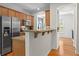 Bright kitchen with stainless steel appliances, granite counters and breakfast bar at 1723 Highlands Se Vw, Smyrna, GA 30082