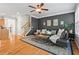 Inviting living room with modern decor, hardwood floors, fireplace, and large windows overlooking the trees at 1723 Highlands Se Vw, Smyrna, GA 30082