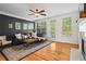 Inviting living room with hardwood floors, modern decor, and plenty of natural light at 1723 Highlands Se Vw, Smyrna, GA 30082