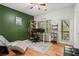 Comfortable living room space with hardwood floors, natural light, and office area at 1723 Highlands Se Vw, Smyrna, GA 30082