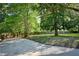 A spacious backyard features mature trees and a long, sturdy fence that provides privacy and security at 20 Old Oak Ct, Covington, GA 30016