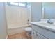 Bathroom featuring tile floors, a single sink vanity, a toilet, and a shower and tub combination at 20 Old Oak Ct, Covington, GA 30016