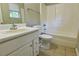Bathroom featuring tile floors, a single sink vanity, a toilet, and a shower and tub combination at 20 Old Oak Ct, Covington, GA 30016