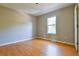 Bedroom with ample natural light and wood flooring, providing a serene retreat at 20 Old Oak Ct, Covington, GA 30016