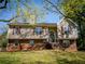 Beautiful split-level home with brick accents, siding, and a well-maintained front yard at 20 Old Oak Ct, Covington, GA 30016