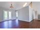 Open living space featuring hardwood floors, a fireplace, and plenty of natural light at 20 Old Oak Ct, Covington, GA 30016