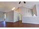 Open concept living room with vaulted ceilings, hardwood floors, fireplace, and natural light at 20 Old Oak Ct, Covington, GA 30016