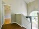 Bright upstairs landing with hardwood floors, natural light, and views to the entryway at 20 Old Oak Ct, Covington, GA 30016