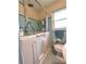 Cozy bathroom featuring blue tile, a walk-in tub, and a bright window at 3556 Forest Hill Rd, Powder Springs, GA 30127