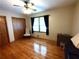 Bedroom with hardwood floors, ample natural light, and neutral-toned walls at 3556 Forest Hill Rd, Powder Springs, GA 30127