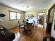Elegant dining area with hardwood floors and a stylish glass-top table at 3556 Forest Hill Rd, Powder Springs, GA 30127