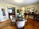 Cozy dining room featuring a glass table and view of an adjacent room at 3556 Forest Hill Rd, Powder Springs, GA 30127