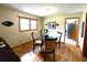 Cozy dining room featuring a glass table and wood floor at 3556 Forest Hill Rd, Powder Springs, GA 30127