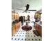 Traditional kitchen with ample cabinets, stainless appliances, and adjacent dining area at 3556 Forest Hill Rd, Powder Springs, GA 30127