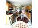 Charming kitchen with wood cabinets, stainless steel appliances, and unique flooring at 3556 Forest Hill Rd, Powder Springs, GA 30127