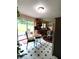 Bright kitchen with a sliding door to the deck and backyard, eat-in dining, and stainless refrigerator at 3556 Forest Hill Rd, Powder Springs, GA 30127