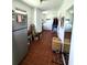 Functional laundry area featuring ample cabinet space, modern appliances, and tiled floor at 3556 Forest Hill Rd, Powder Springs, GA 30127