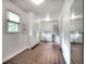 Spacious laundry room with white cabinets, tile flooring, and modern appliances at 3556 Forest Hill Rd, Powder Springs, GA 30127