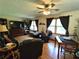 Comfortable living room with hardwood floors, built-in shelving, and plenty of seating at 3556 Forest Hill Rd, Powder Springs, GA 30127