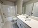 Bathroom with tub/shower, toilet, and vanity with sink and mirror at 1217 Fern Ridge Ct # 16, Norcross, GA 30093