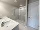 Bathroom with double sink vanity and glass enclosed shower stall at 1217 Fern Ridge Ct # 16, Norcross, GA 30093