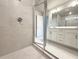 Modern bathroom featuring glass shower and vanity with white cabinets at 1217 Fern Ridge Ct # 16, Norcross, GA 30093