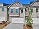 Charming townhome features painted brick, white garage door, and well-maintained landscaping at 1217 Fern Ridge Ct # 16, Norcross, GA 30093