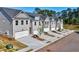 Street view of new construction townhomes with individual driveways and gray color scheme at 1217 Fern Ridge Ct # 16, Norcross, GA 30093