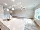 Bright kitchen with quartz countertops, stainless appliances, and hardwood flooring in an open space concept at 1217 Fern Ridge Ct # 16, Norcross, GA 30093