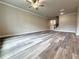 Spacious living room with wood-look floors and views of entry way and staircase at 1217 Fern Ridge Ct # 16, Norcross, GA 30093