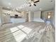 Bright open-concept living room with hardwood floors, modern kitchen, and plenty of natural light at 1217 Fern Ridge Ct # 16, Norcross, GA 30093