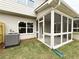 View of a screened-in patio, an AC unit and a view of the yard from the patio at 1217 Fern Ridge Ct # 16, Norcross, GA 30093