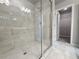 Tile shower in Primary bath with walk-in closet at 1227 Fern Ridge Ct # 17, Norcross, GA 30093